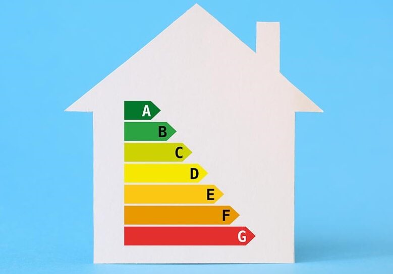 Paper house with energy efficiency chart